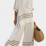 Salopeta s širokim prugama i asimetričnim rezom - moderno i udobno stil